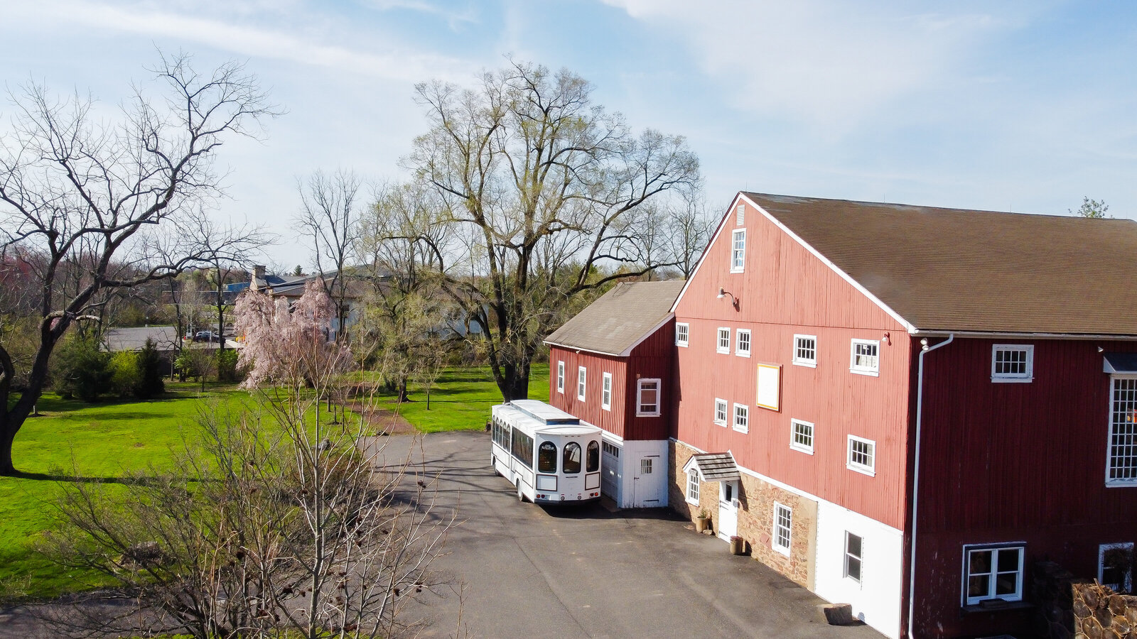 Red barn with white trolley