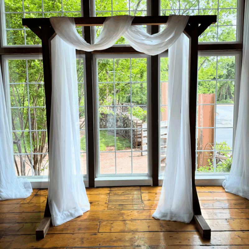 Wooden Arbor with White Drapery