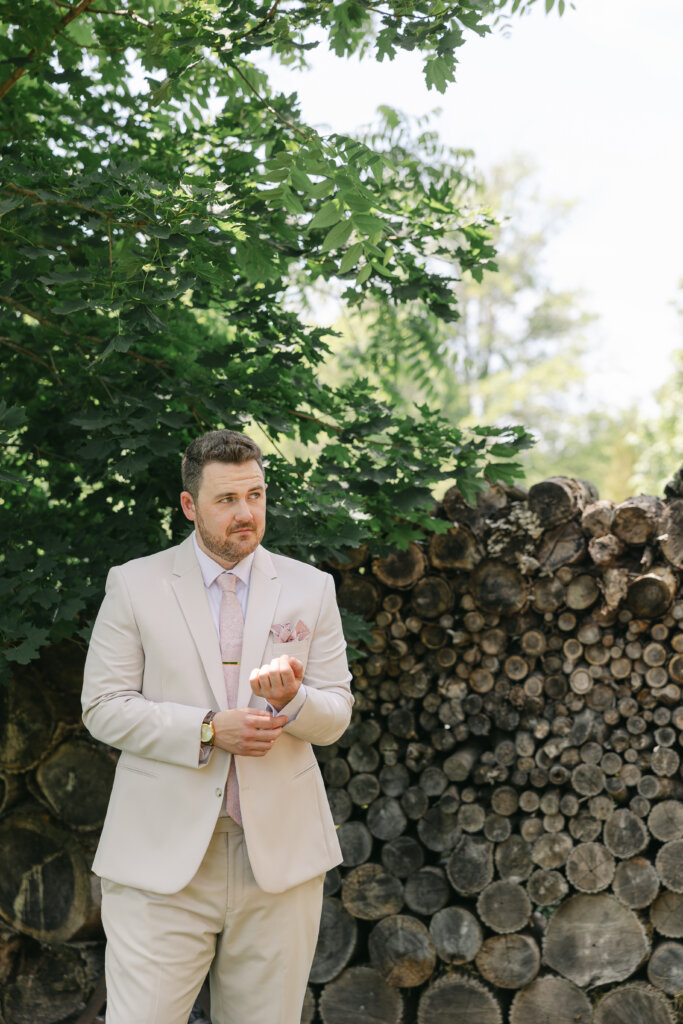 Portrait of a groom getting ready for wedding ceremony at Lochwood Manor, Skippack, PA