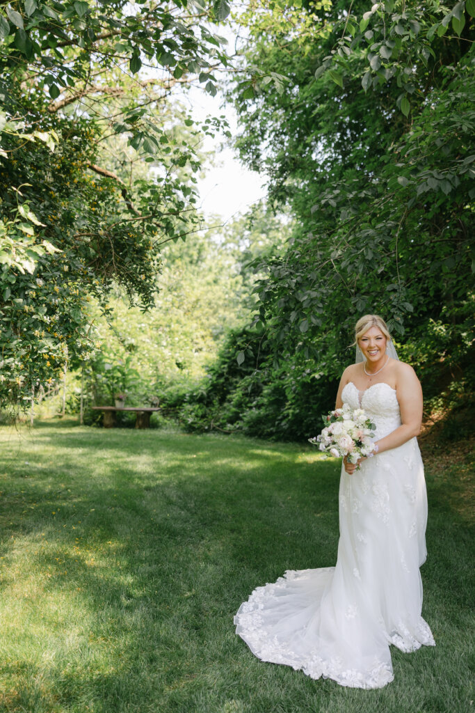 Portrait of a bride on the grounds of Lochwood Manor, a barn venue in Pennsylvania