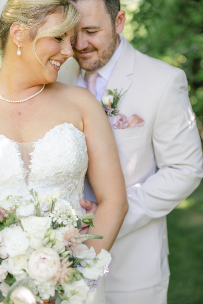 Portrait of a bride and groom sharing a first look before a wedding at Lochwood Manor