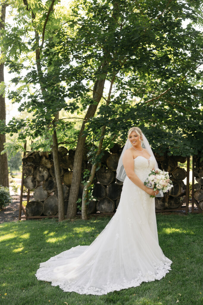 Bride on the grounds at Lochwood Manor, a barn venue in Montgomery County PA