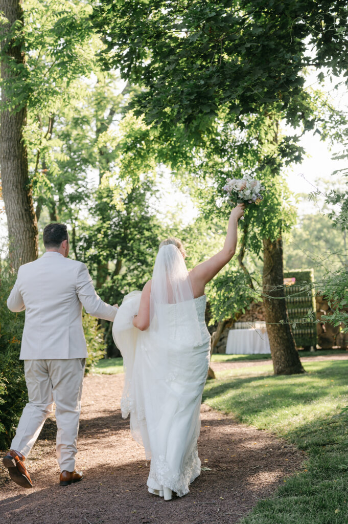 Bride and groom on the grounds at Lochwood Manor, a barn venue in Montgomery County PA