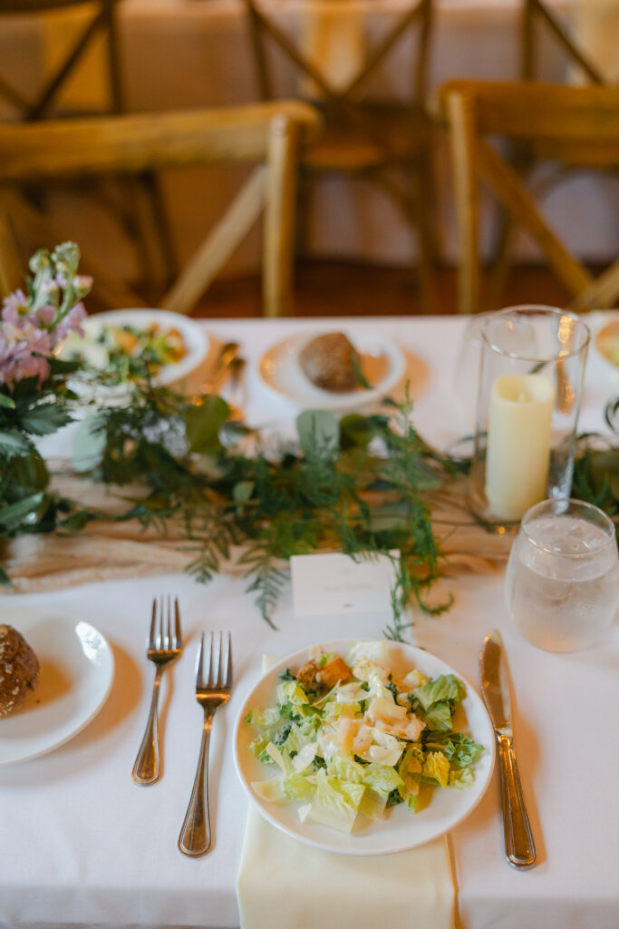 Reception tables in barn ballroom for wedding at Lochwood Manor