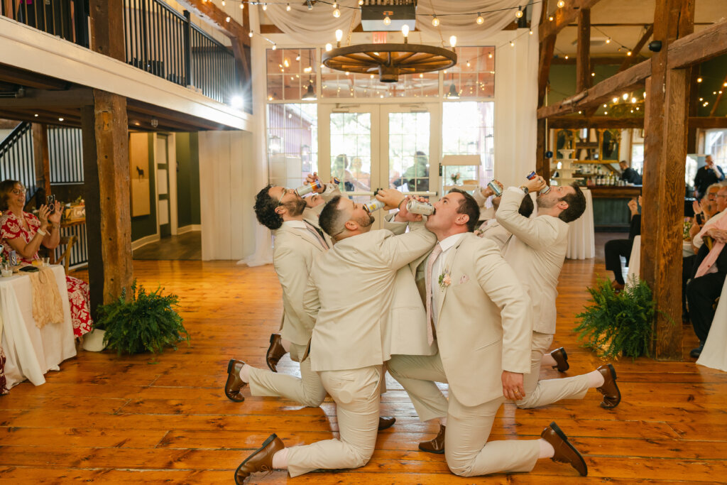 Groomsmen celebrating at wedding reception Lochwood Manor, Skippack PA