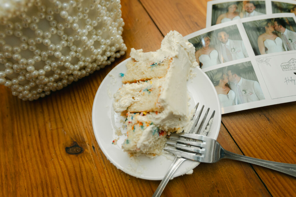 Wedding cake and photo strip at wedding at Lochwood Manor